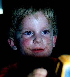 Dirty little 3 year old with a truck