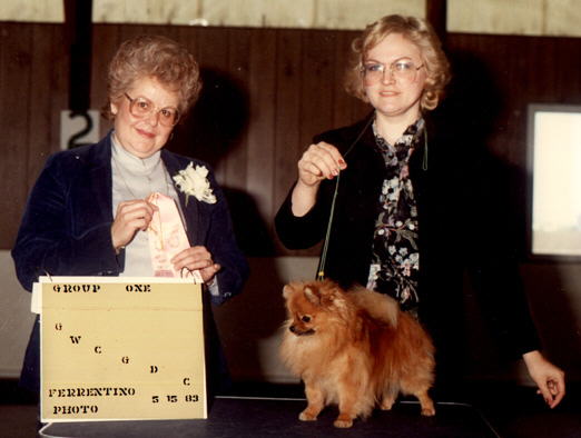 Blonde Woman with cute little fluffy dog.